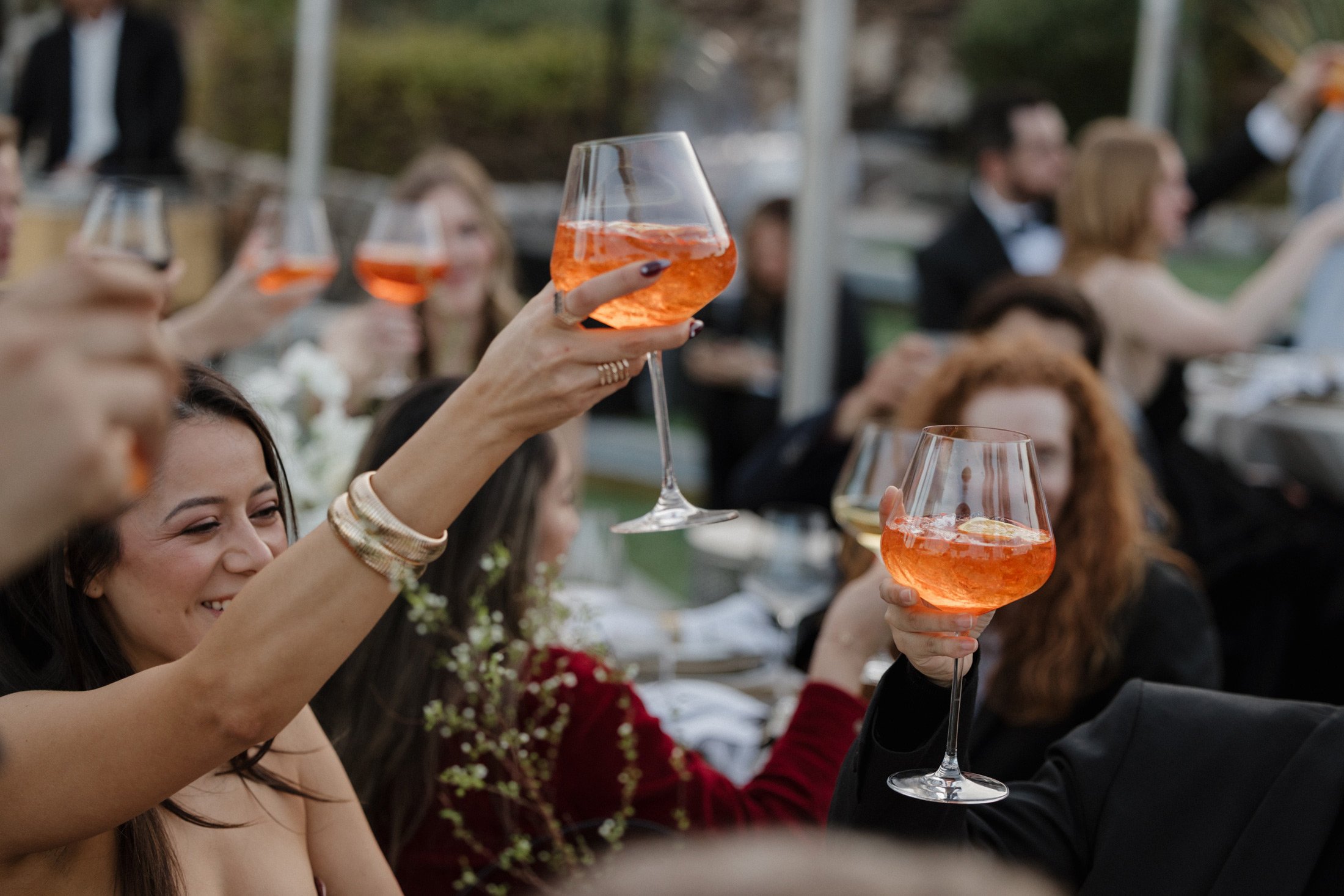 Guests toasting cocktails at a wedding reception catered by a Palm Springs 