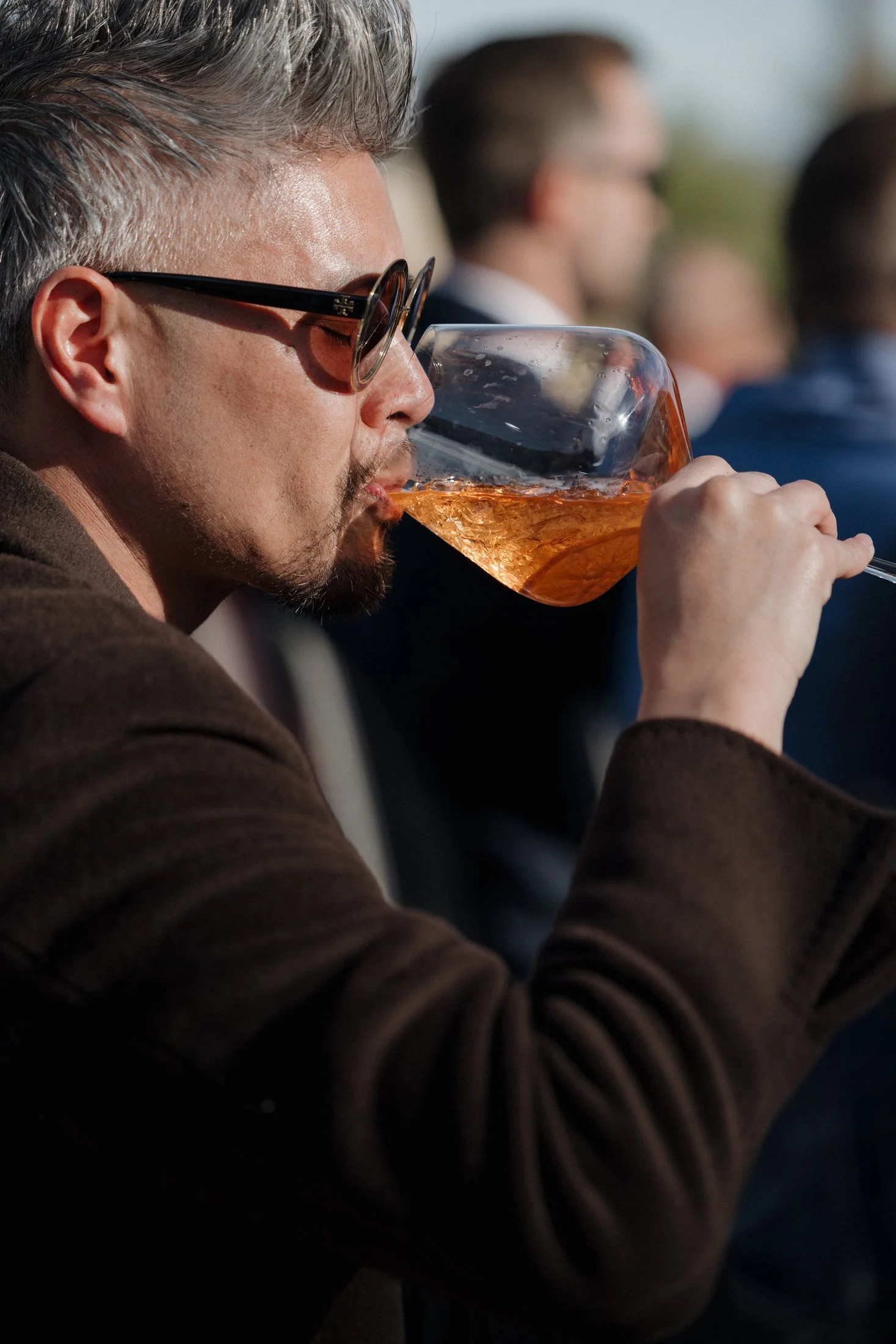 Man drinking rosé wine at Palm Springs wedding
