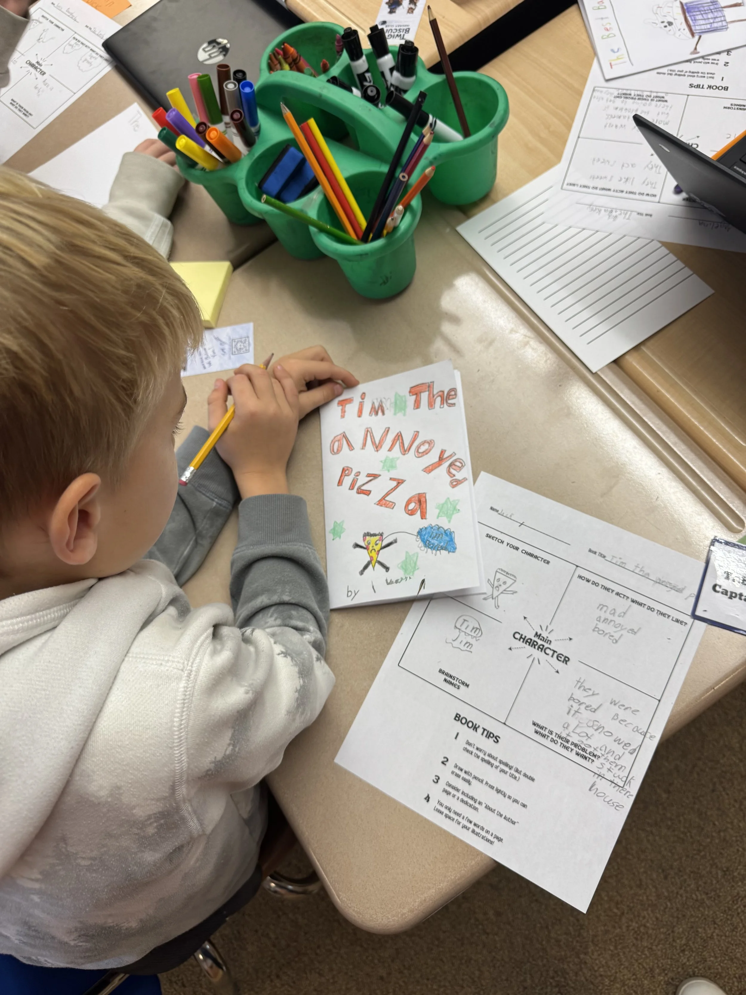 Author visit writing workshop with Melissa Trempe where students create their own books.