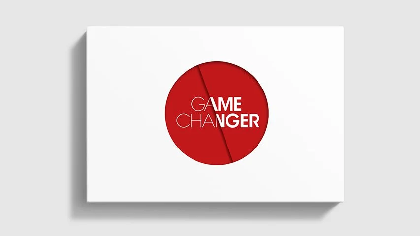 A white rectangular box with a red circular pie chart in the center, labeled 'GAME CHANGER' in white and black text.