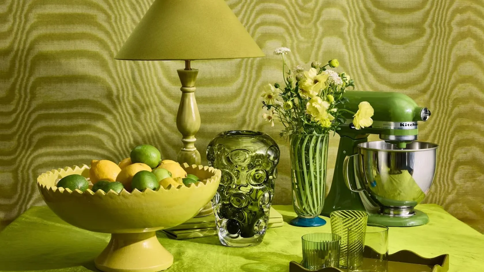 Autumn and Holiday 2026 home decor trends with burgundy velvet, moss green, dark wood, brass and layered textiles