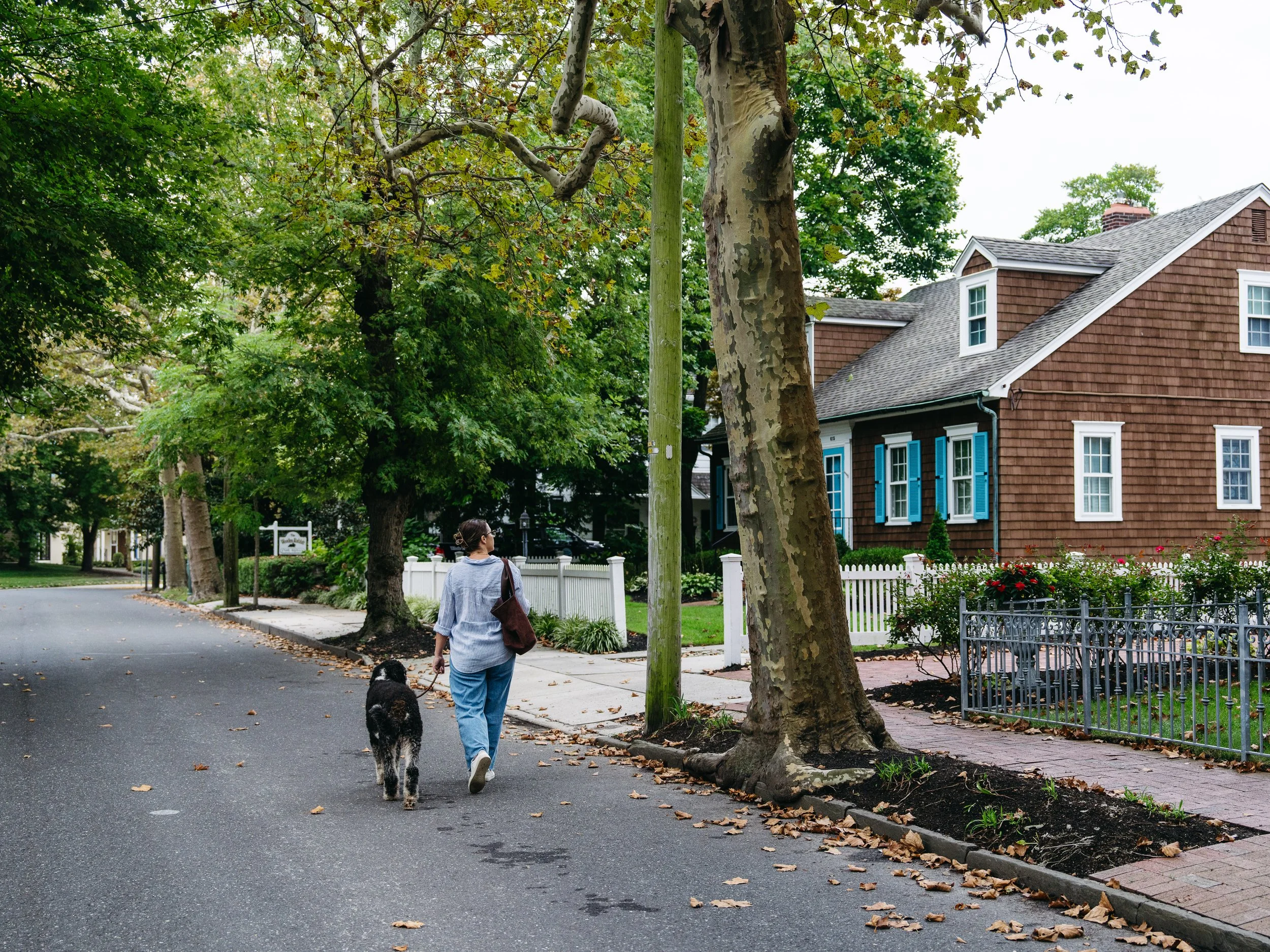 woman walking her large dog down Cape May streets