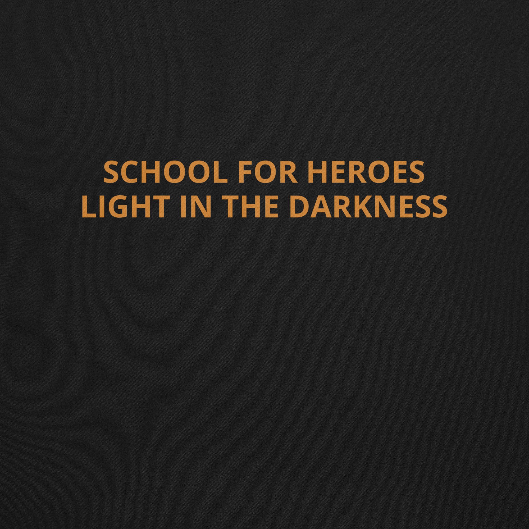 Person wearing black School for Heroes Training T-Shirt showing Light in the Darkness back print
