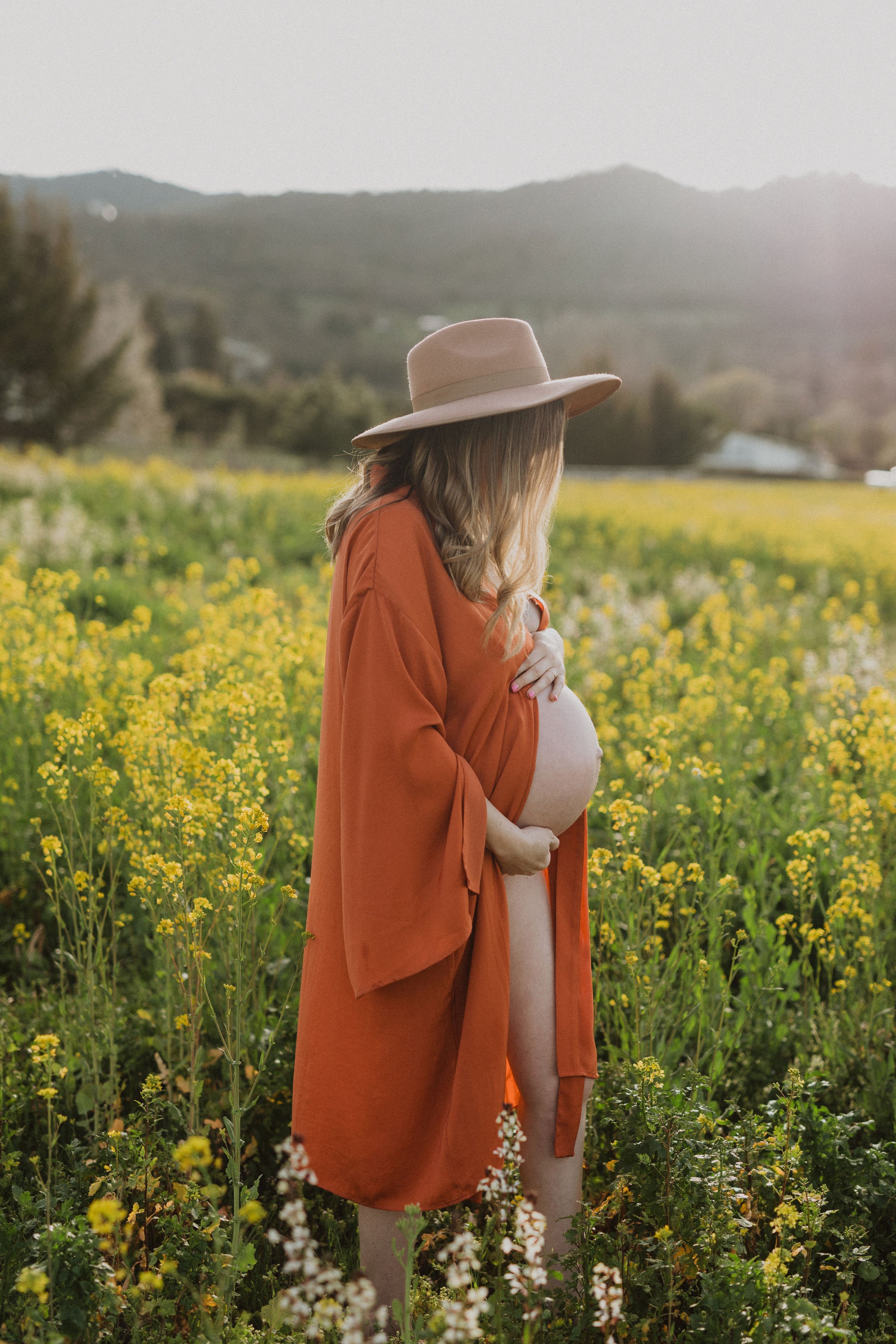 Wildflower mustard seed field intimate maternity session