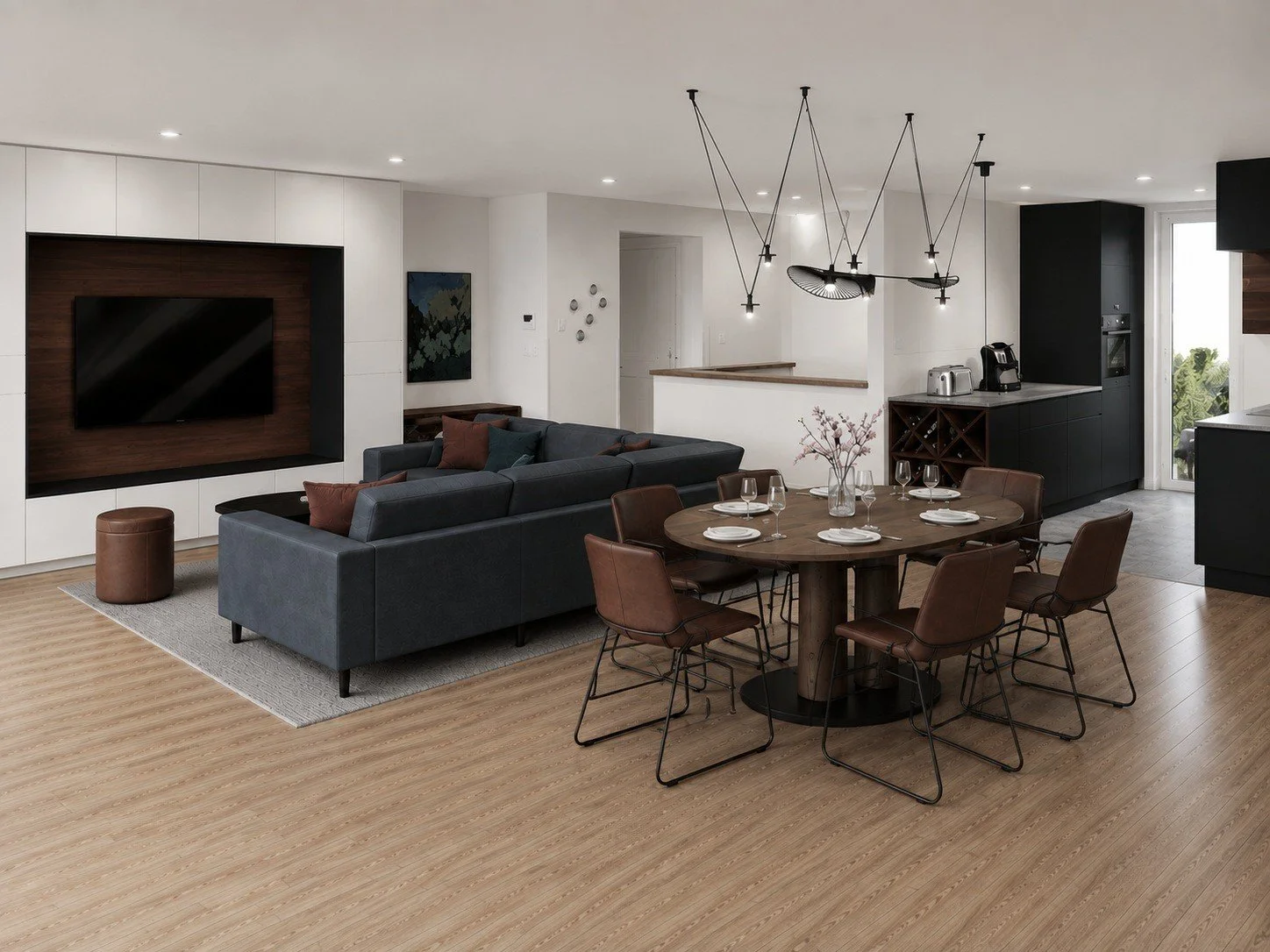 Open-plan townhouse living and dining concept with dark seating and a round dining table.
