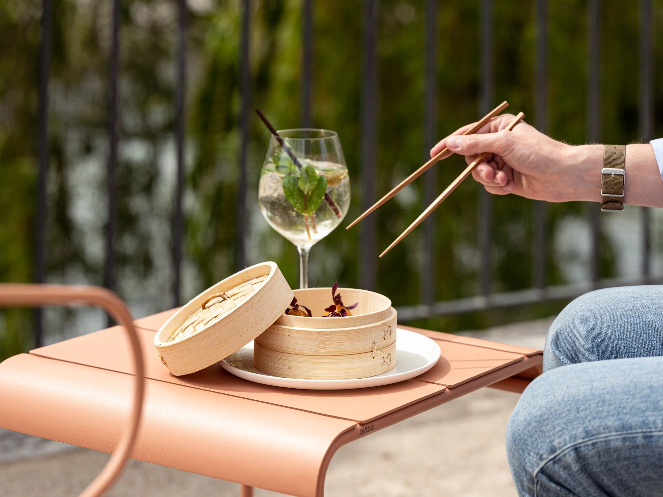 Food served on a timber board at an outdoor summer pop-up restaurant.