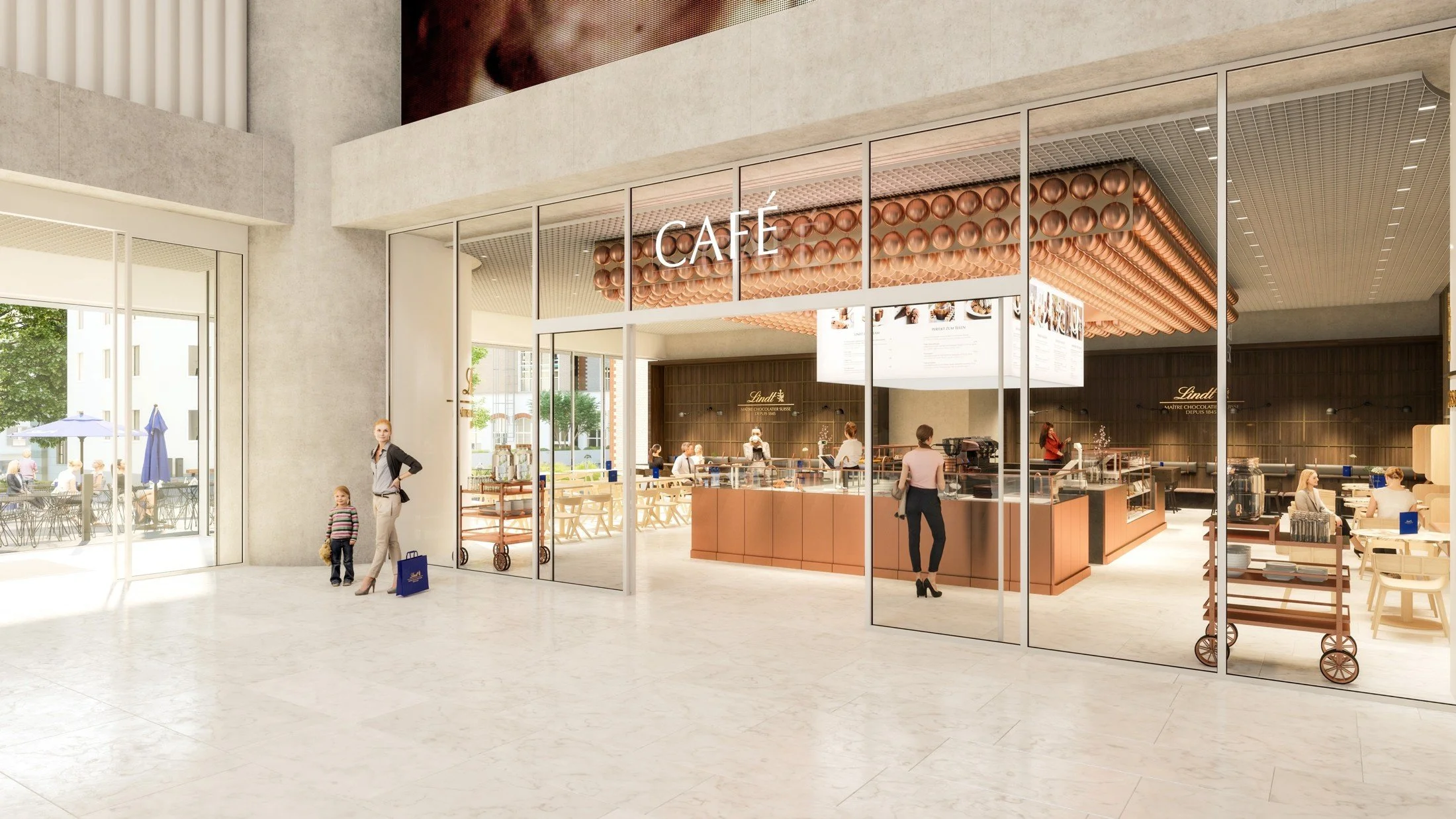 Entrance to the Lindt Home of Chocolate café with glazed walls, warm timber counters and decorative ceiling details.