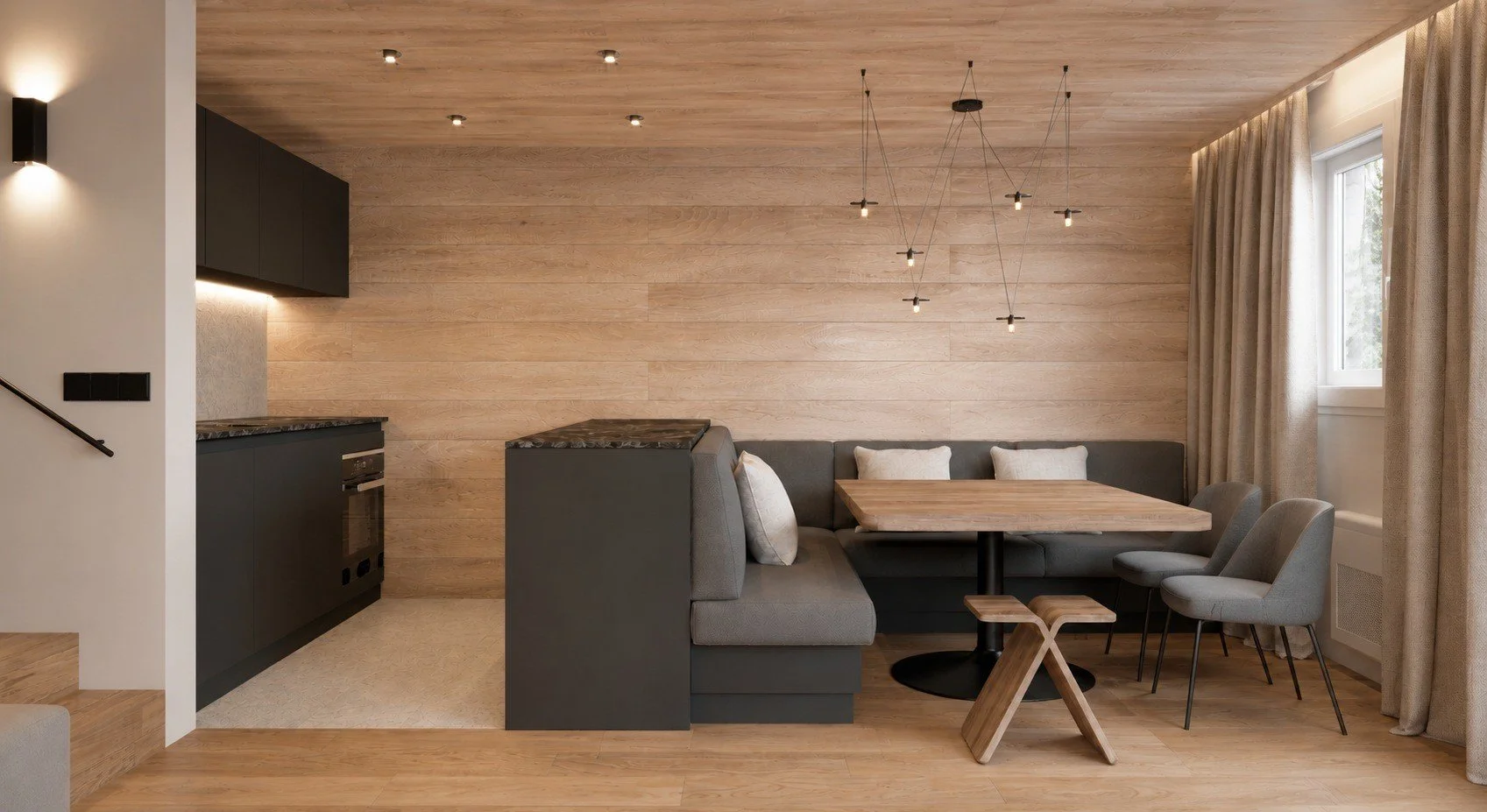 La Clusaz apartment concept with timber wall cladding, a built-in dining bench and contemporary chairs.