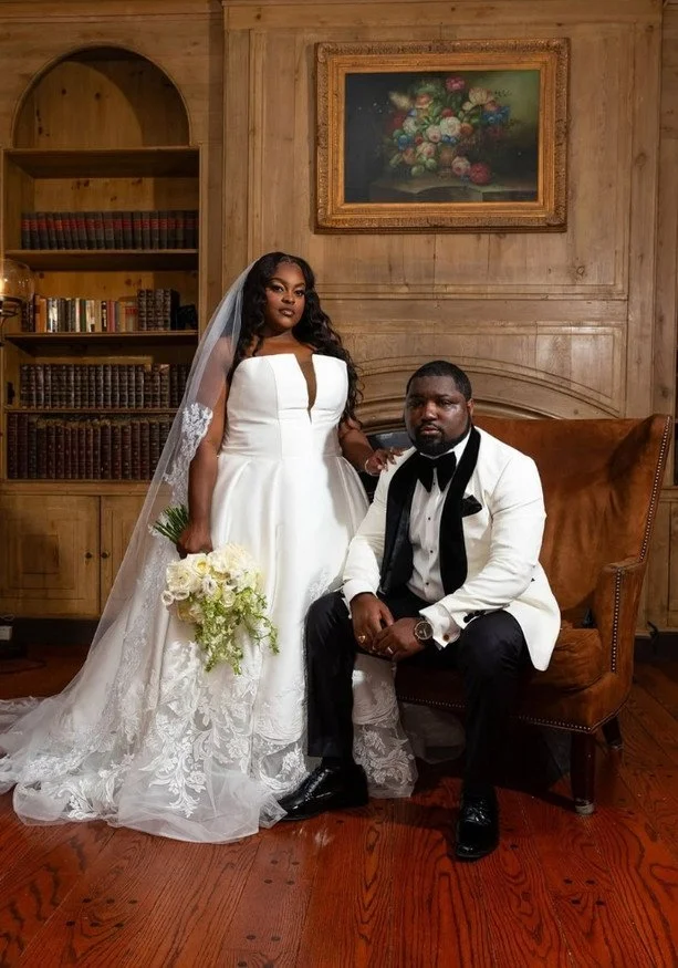 Bride wearing a satin modern plus size wedding dress