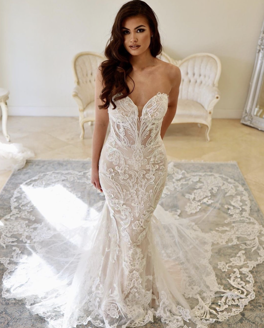 Bride wearing a lace wedding dress from a bridal shop near Winston Salem NC