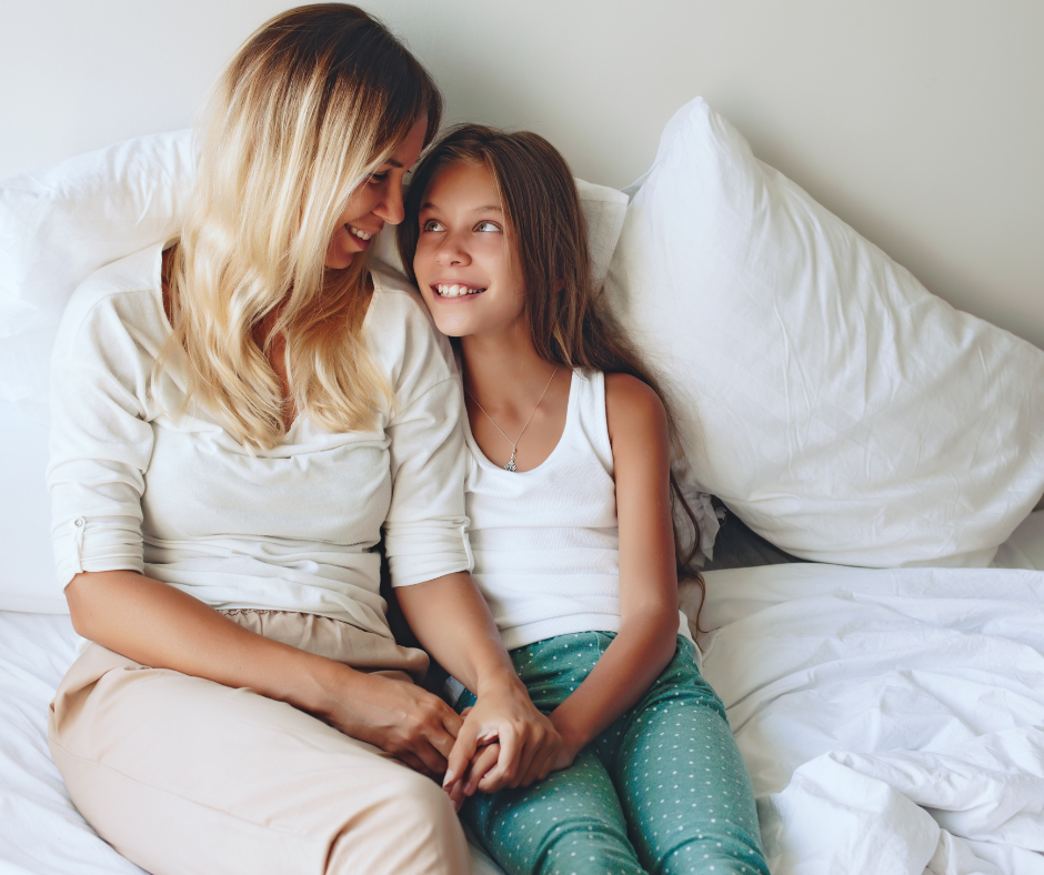 tween in bed with mom.png