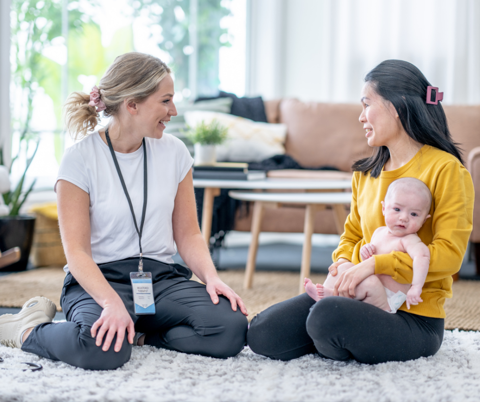 Doula or nurse doing an in home consultation with a new mom, confidently providing sleep education.