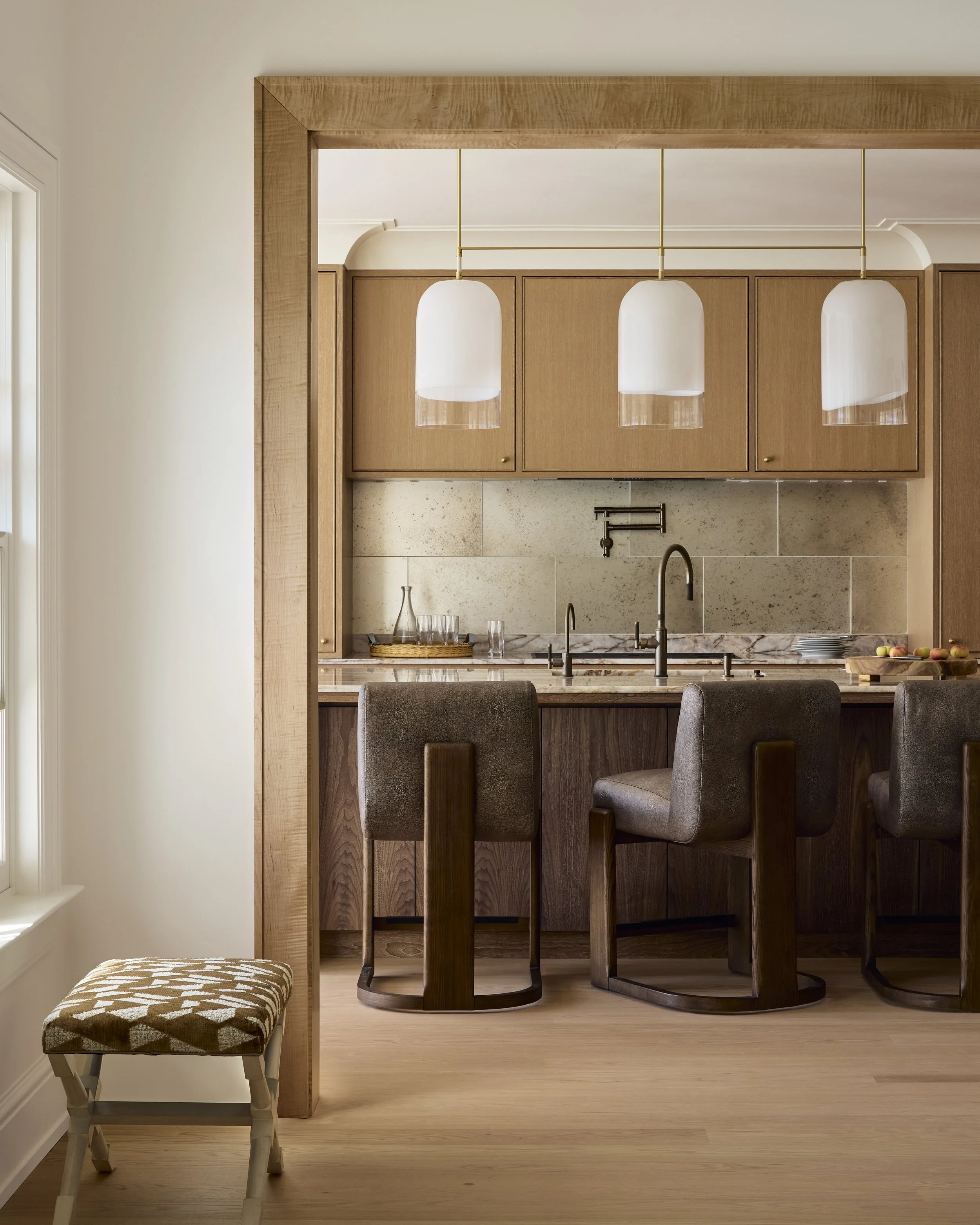 The open plan kitchen is thoughtfully designed for easy entertaining and functional for everyday life. The paneled transitions are of curly maple - a wood typically used to make guitars. 