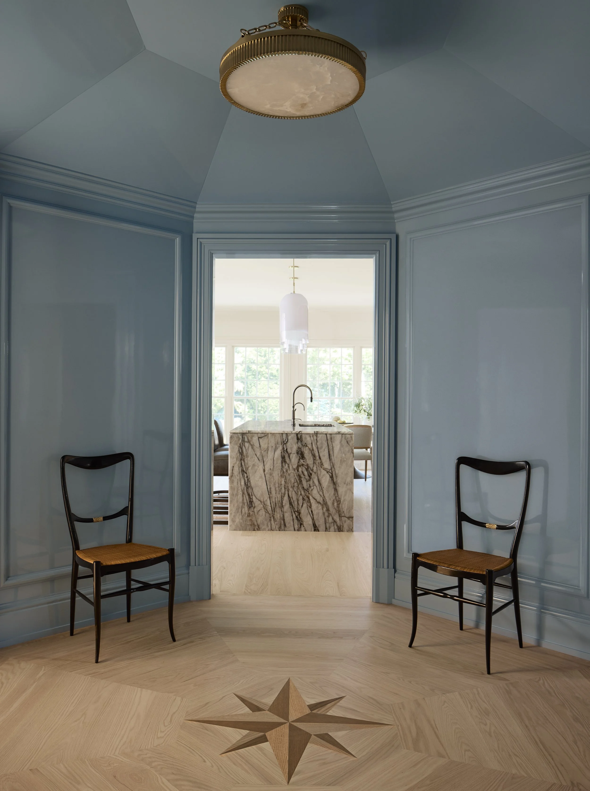 View into the kitchen from the rotunda, which was constructed as an octagon and finished in a pale blue high gloss lacquer. 