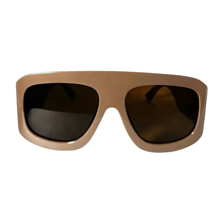 Brown sunglasses with tinted lenses isolated on white background.