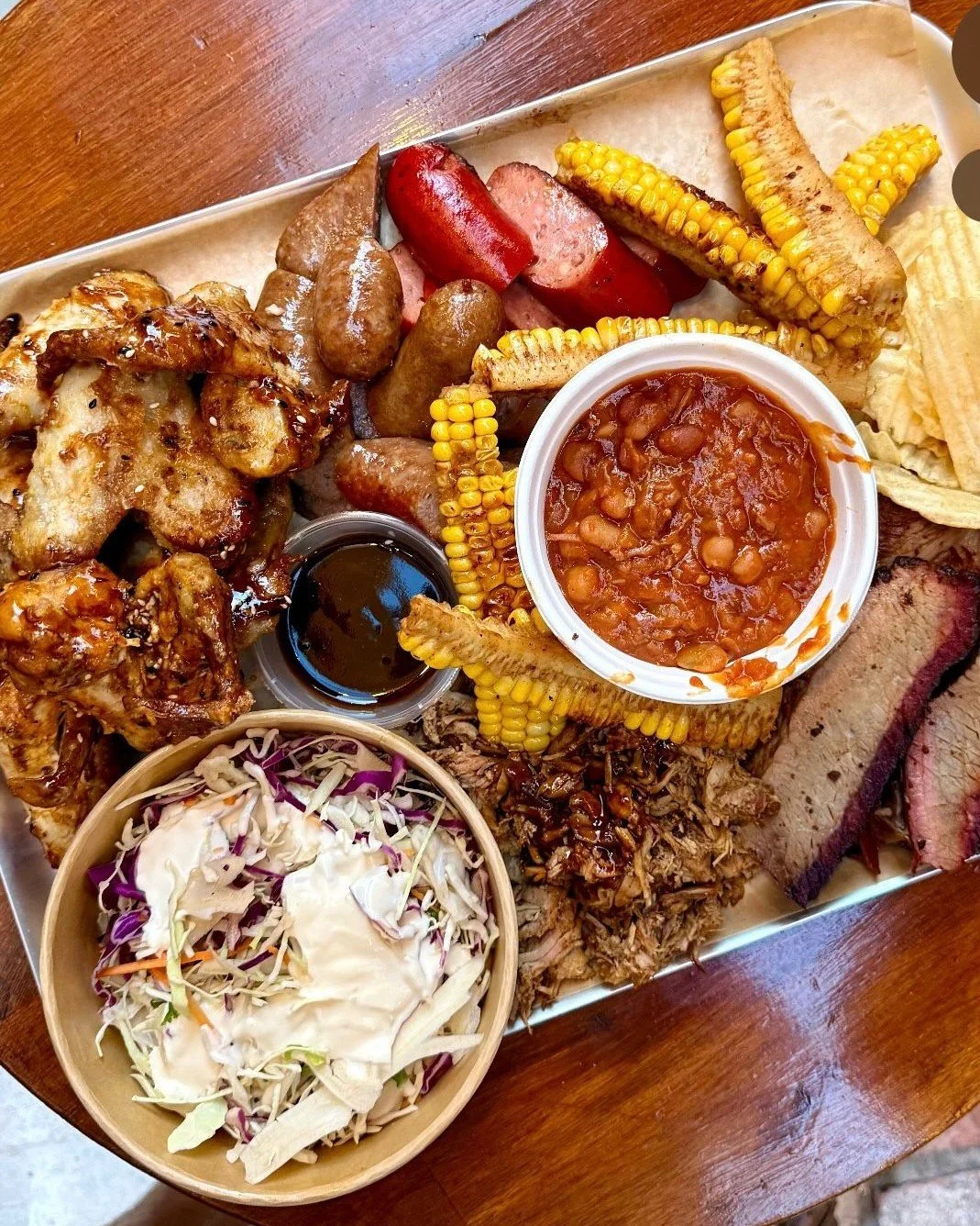 Smoked meat is back in the Three Tails&rsquo; house 🙌🍖 On Fridays &amp; Saturdays, you can now load up on tasty BBQ offerings like brisket, pork shoulder &amp; sausages, plus sides of corn ribs, coleslaw &amp; beans 🤤 
 
On Fridays from 5pm-8pm &a