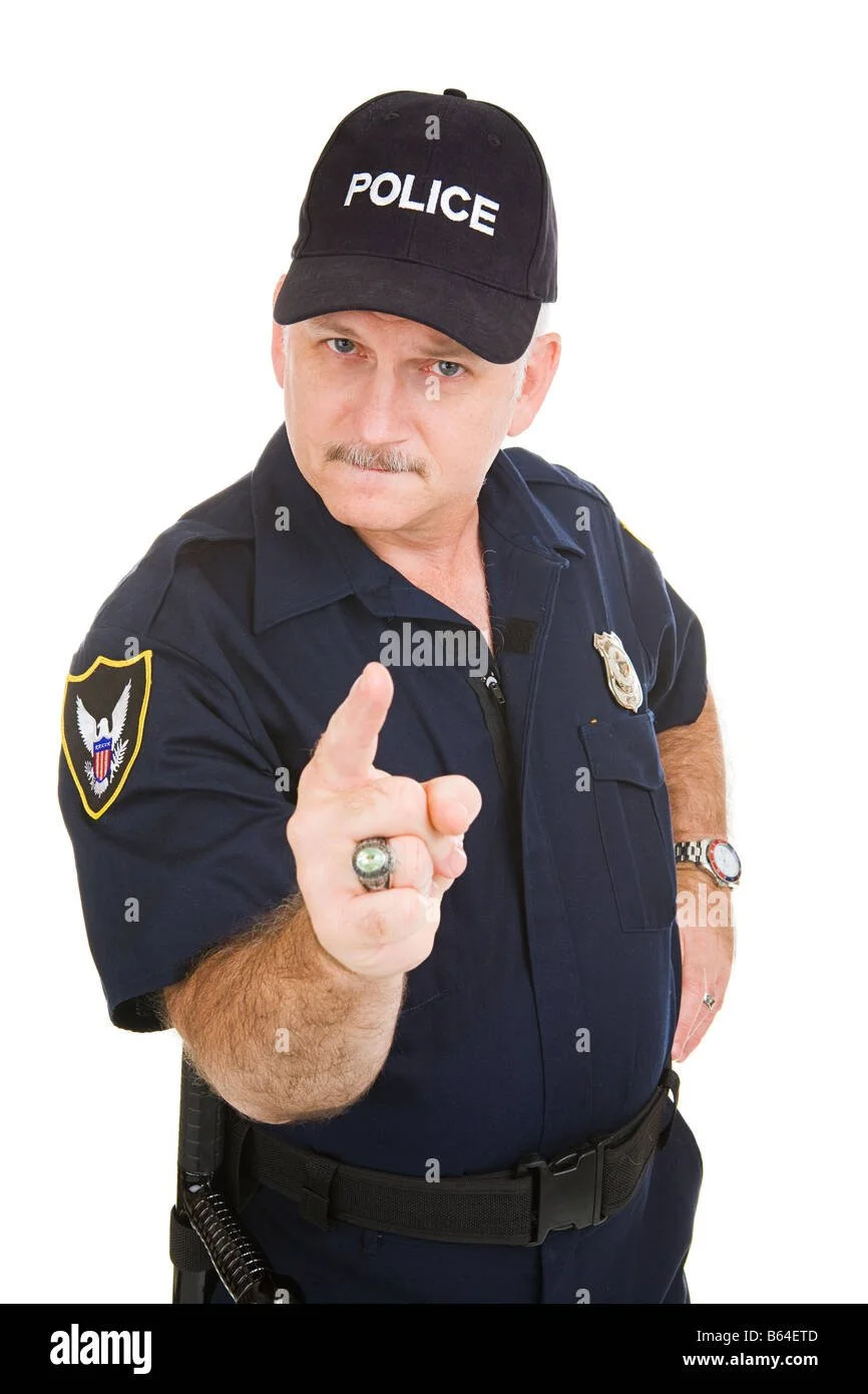 angry-looking-police-officer-pointing-his-finger-at-you-isolated-on-B64ETD.jpg