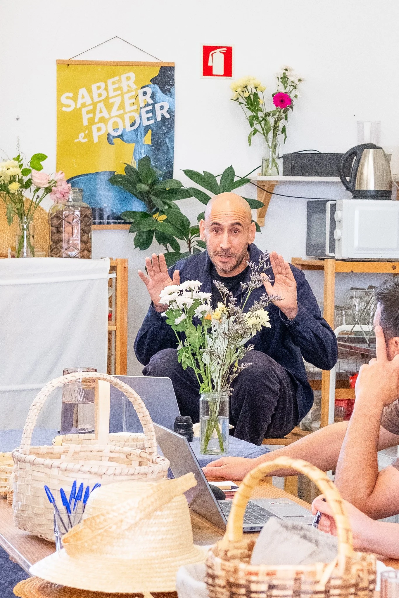 How can we help people who work with their hands to remain competitive in a digital world?