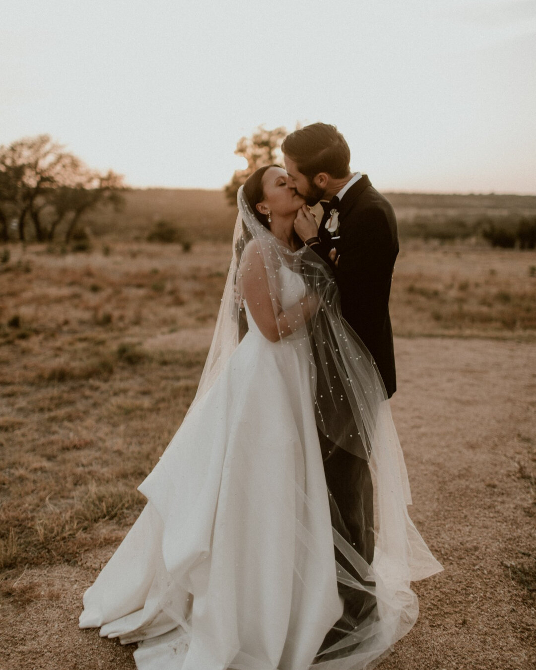 You would never know that it poured buckets of rain on this day! But it sure did make for the prettiest overcast sunset and these dreamy photos with this pearl veil! ​​​​​​​​
​​​​​​​​
Venue: @maesridge​​​​​​​​
Coordination &amp; Design: @simplyxoeven