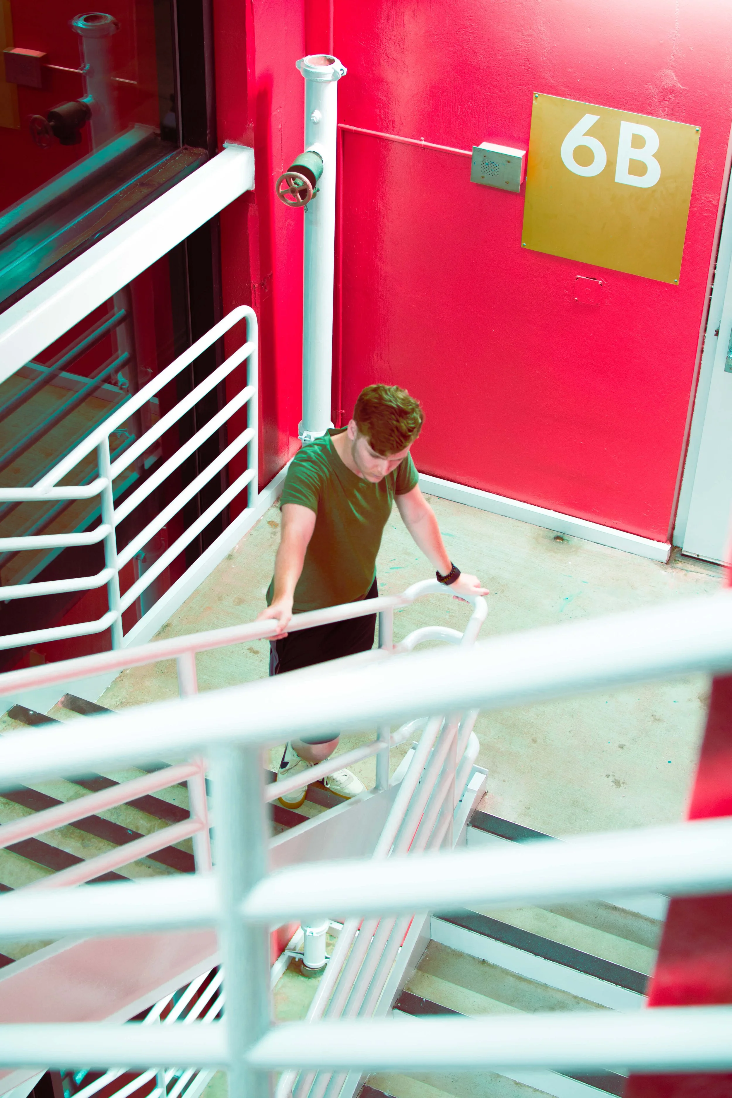 me looking down red stairs.jpg