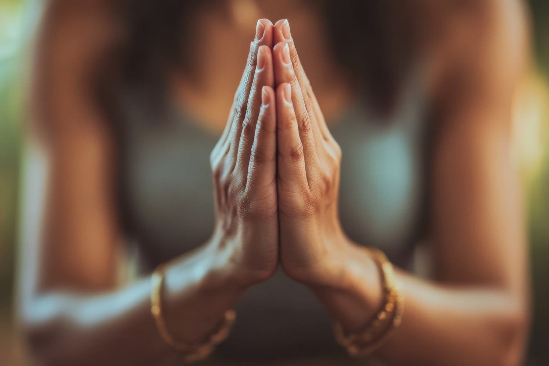 A woman's hands are held together | Aspire Psychology Portland