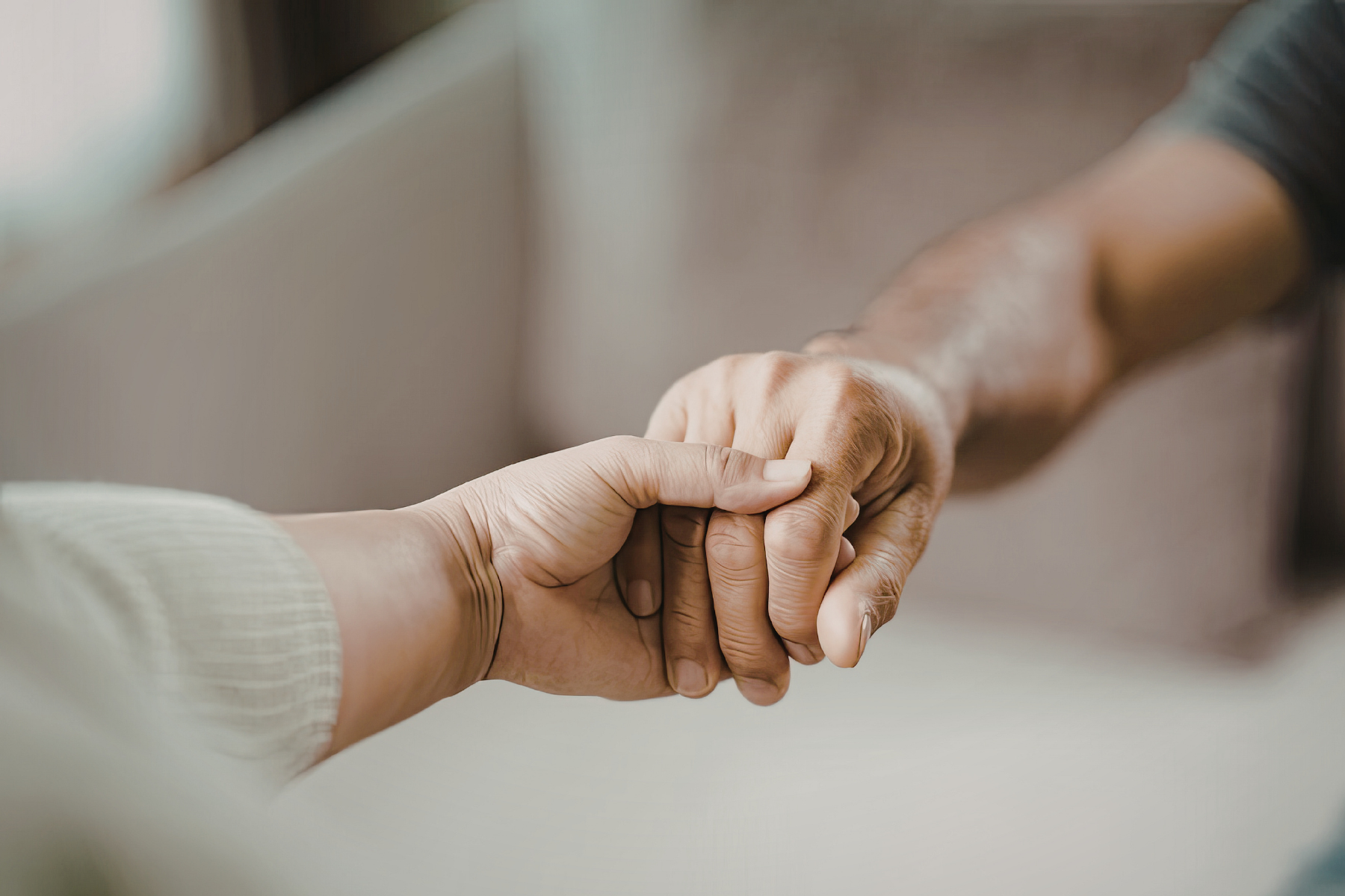 a man and woman hold hands