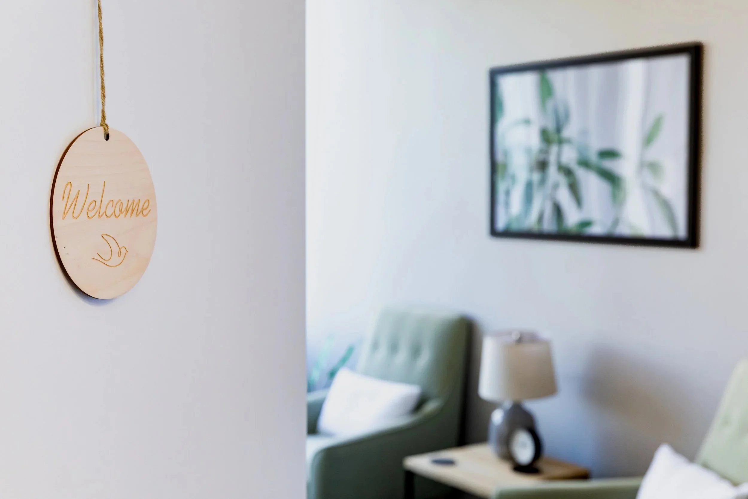 A welcome sign hangs on the door of an office at Aspire Psychology in Portland, Oregon