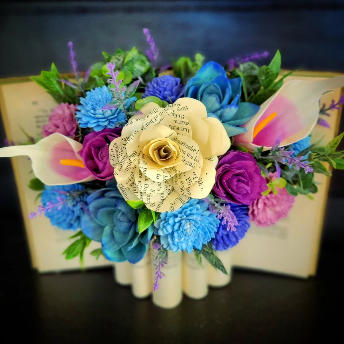 Now that the holidays are over, I can share one of my favorite custom orders.

My client asked for an antique book vase arrangement as a Christmas gift for his wife with some of her favorite colors and favorite flower: calla lillies. If you've been t