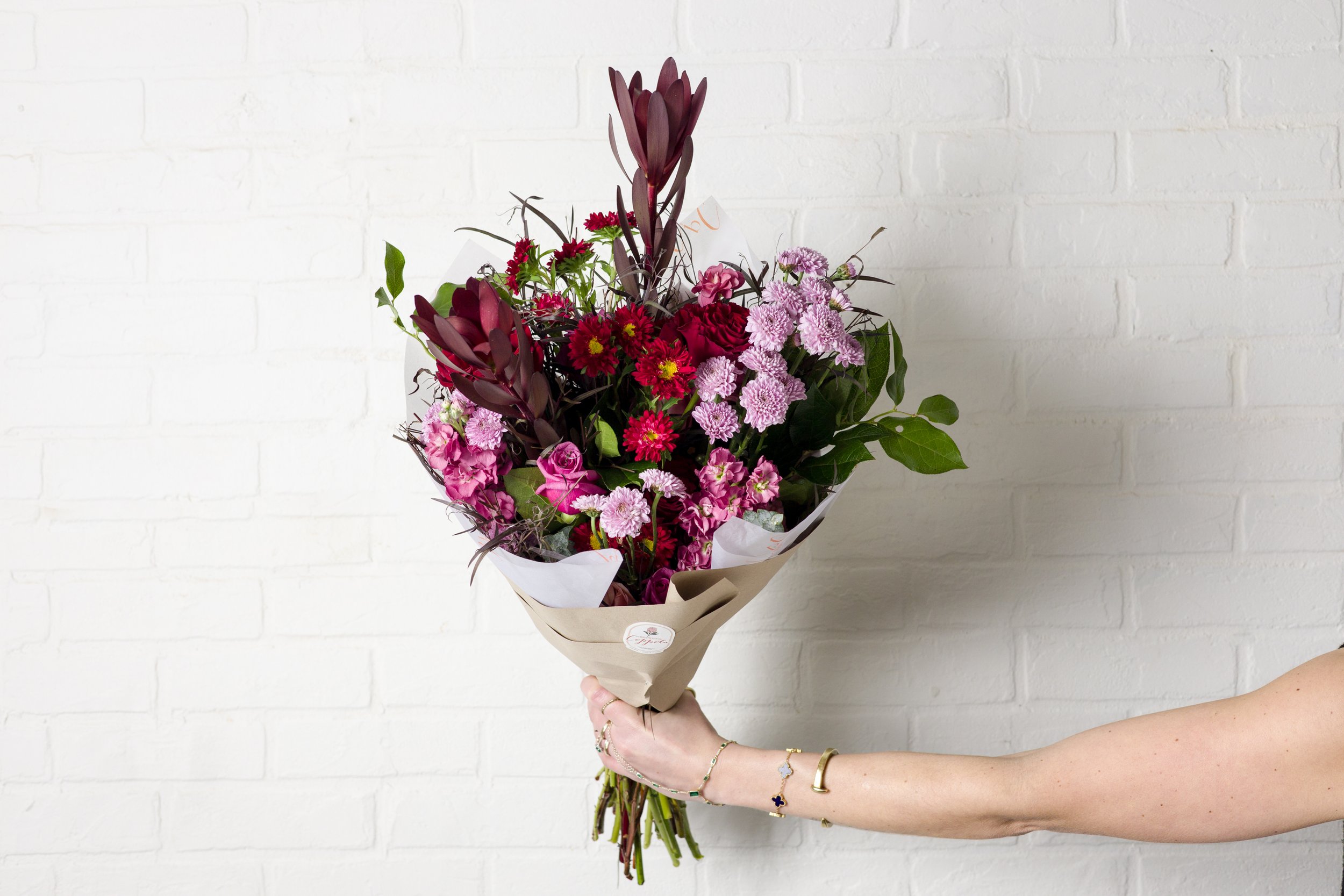 Valentine’s Day bouquet with roses and seasonal blooms, handcrafted by a South Philadelphia florist, modern romantic flowers for delivery or pickup.