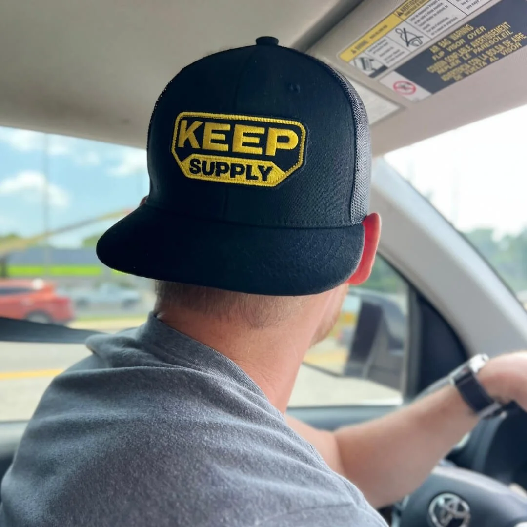 keep supply trucker hat