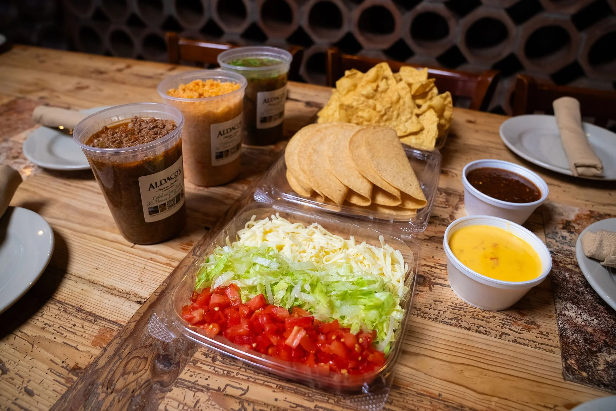 Aldaco's Crispy Taco Kit to-go with picadillo, rice, fixings, chips and queso