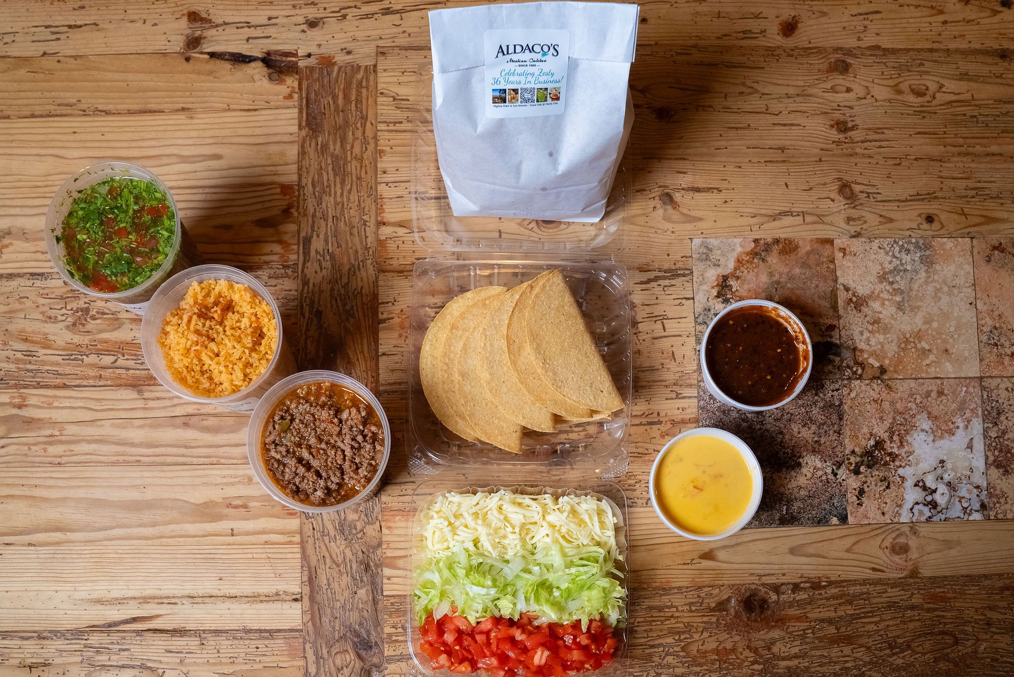 Overhead view of an Aldaco's Taco Kit to-go order in San Antonio