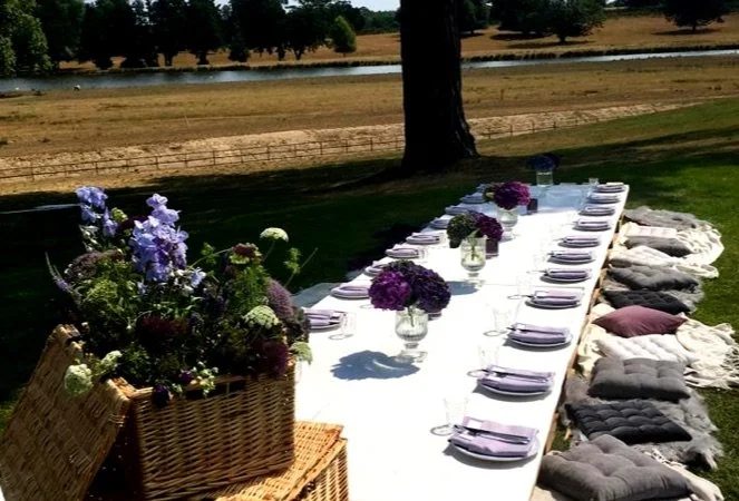 Destination style wedding table laid out in a field
