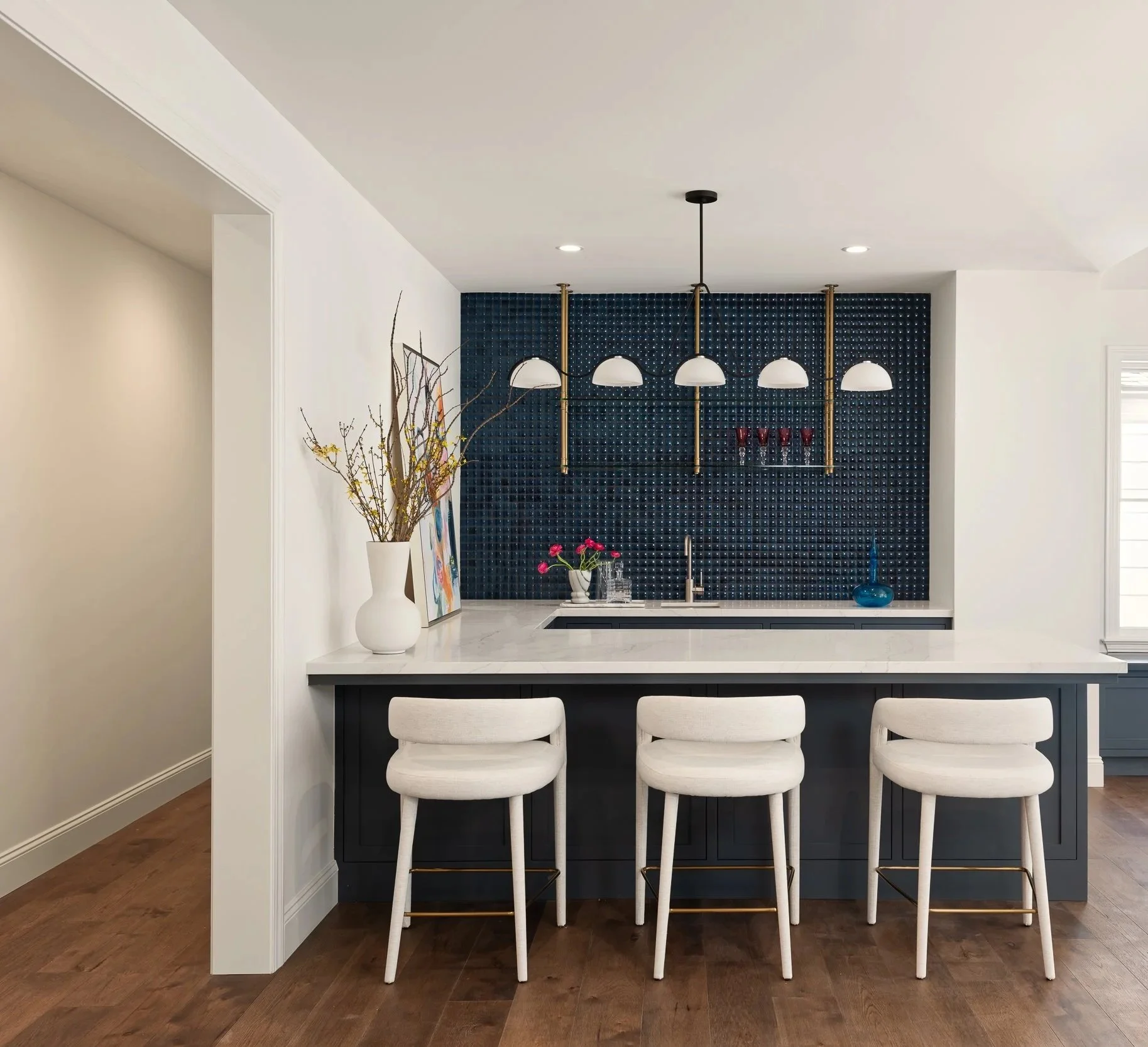 The kitchen and bar of a cape cod residence in Hillsborough