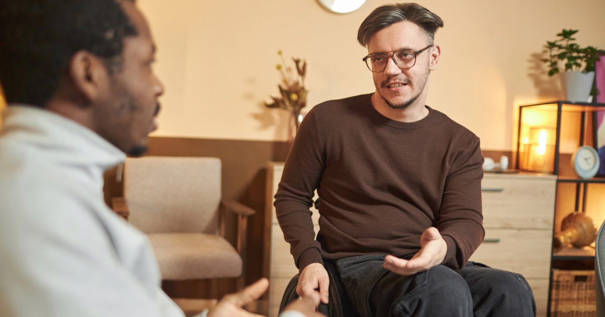 Two men talking in an office