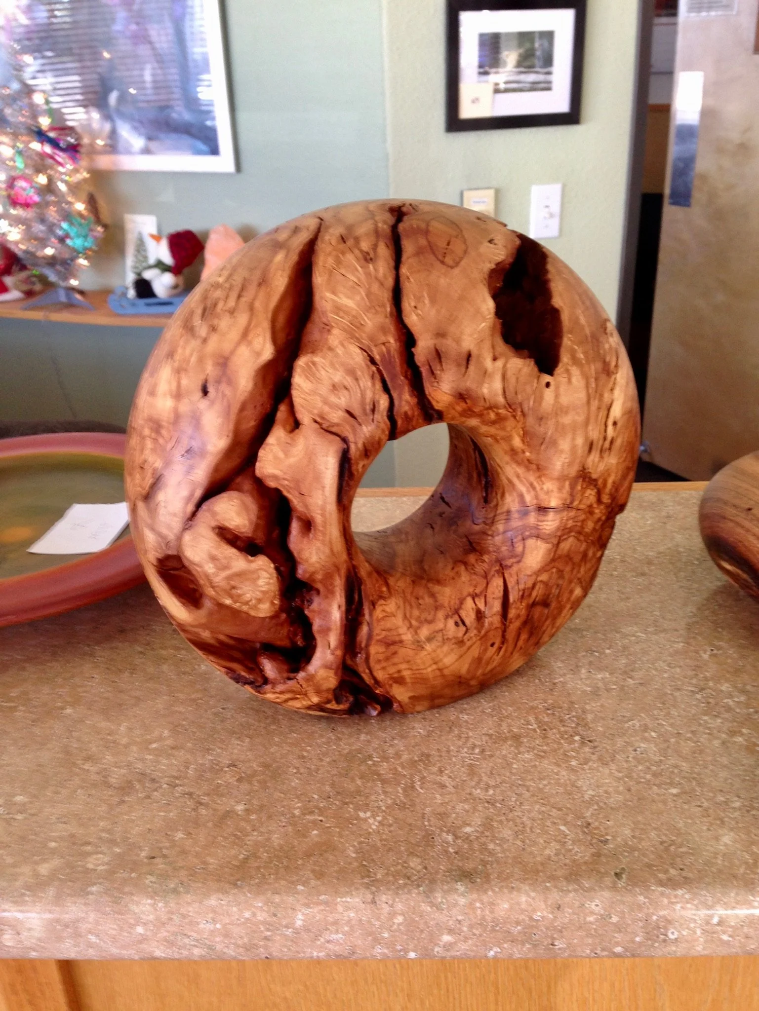 Showcasing the wildly moving grain of olive wood