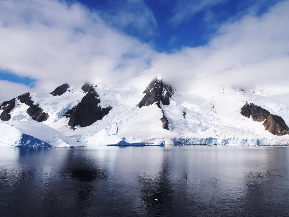 Snow mountains and blue skies in Antarctica