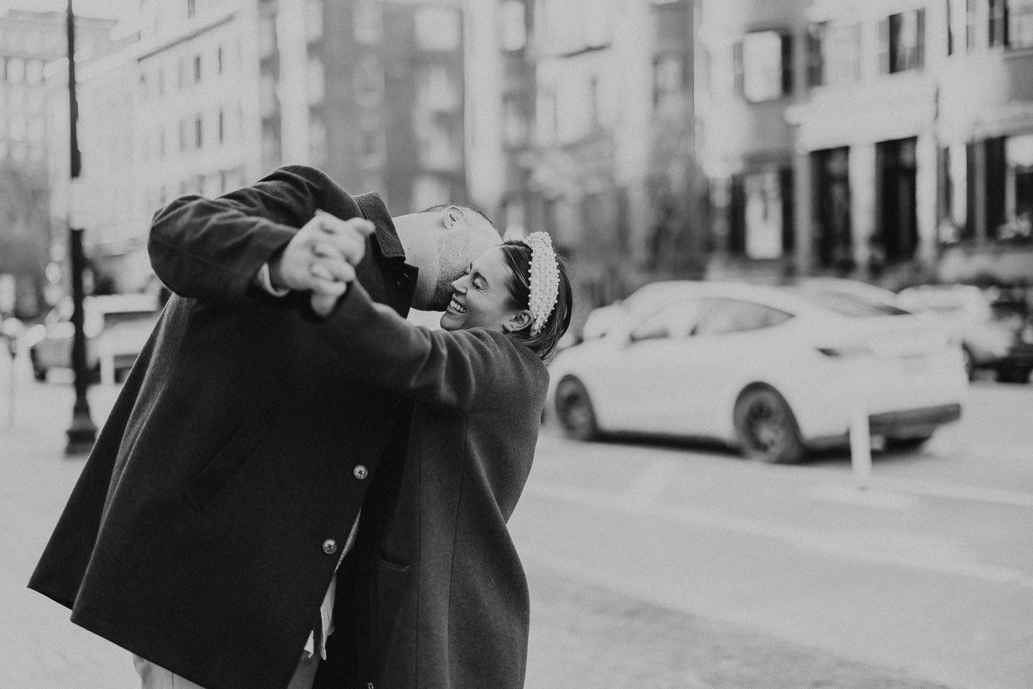 man-kissing-woman-on-cheek-boston-street-monochrome-couples-photographer-pheonix-boston.jpg
