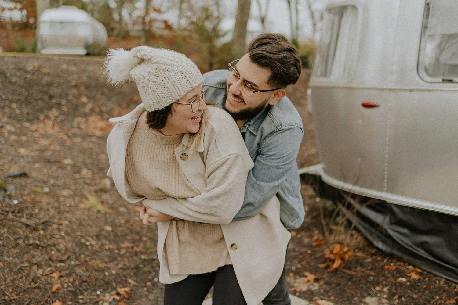 laughing-playful-embracing-couple-outside-airstream-couples-photographer-autumn-skye-pheonix-boston.jpg