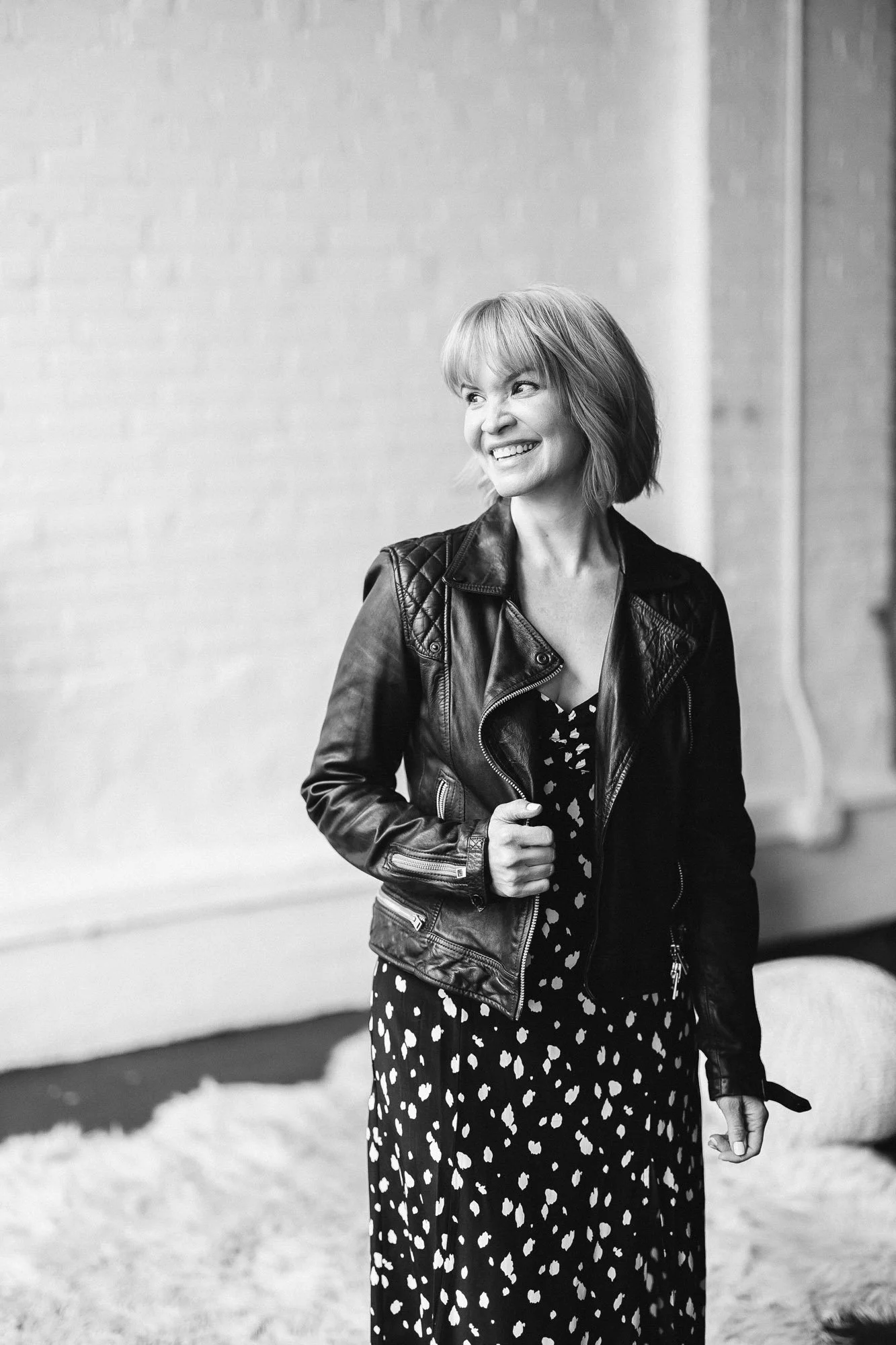 blonde-woman-blue-dress-leather-jacket-in-white-room-monochrome-phoenix-boston.jpg