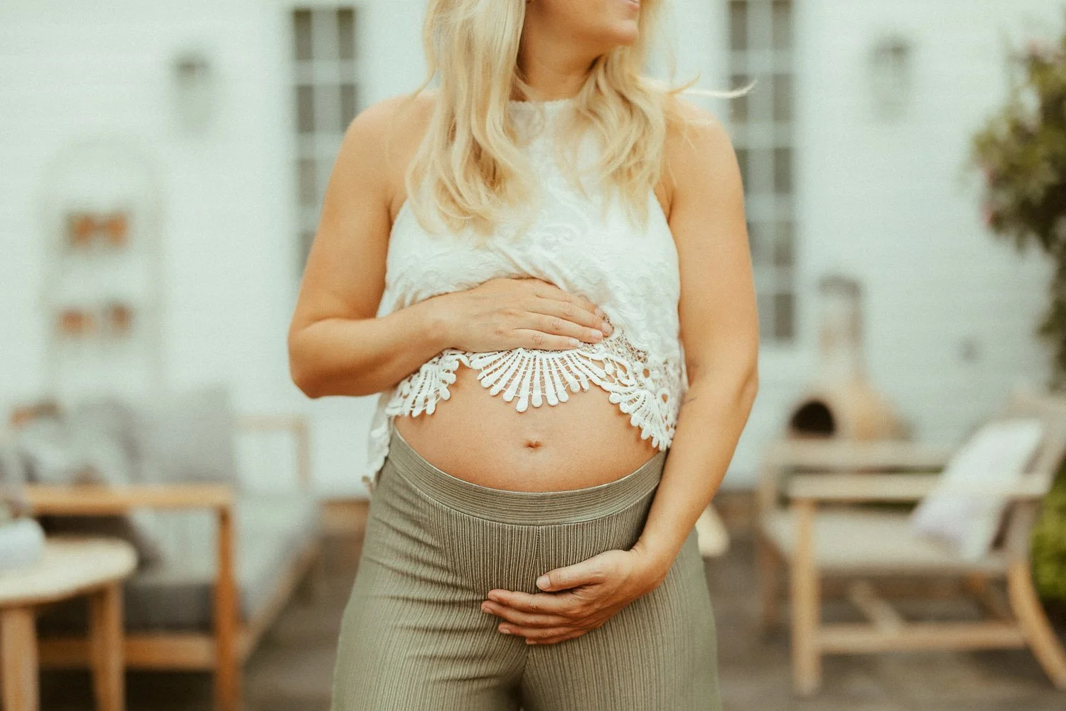 close-crop-woman-cradling-pregnant-bump-family-photographer-autumn-skye-phoenix-boston.jpg
