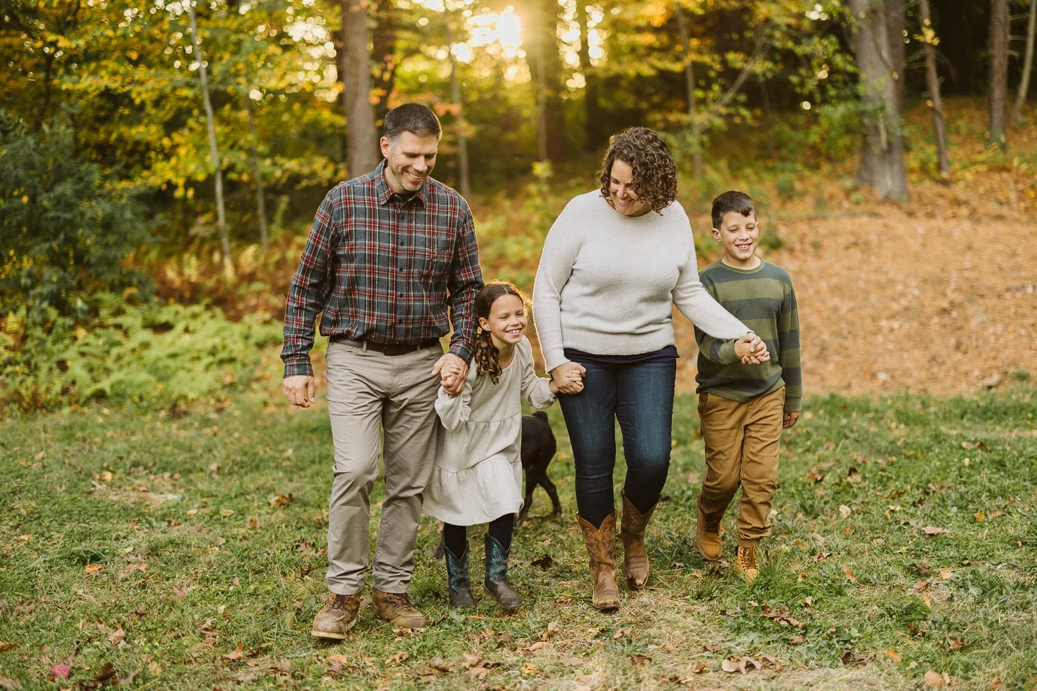 couple-son-daughter-walking-through-woods-sunset-family-photographer-autumn-skye-phoenix-boston.jpg