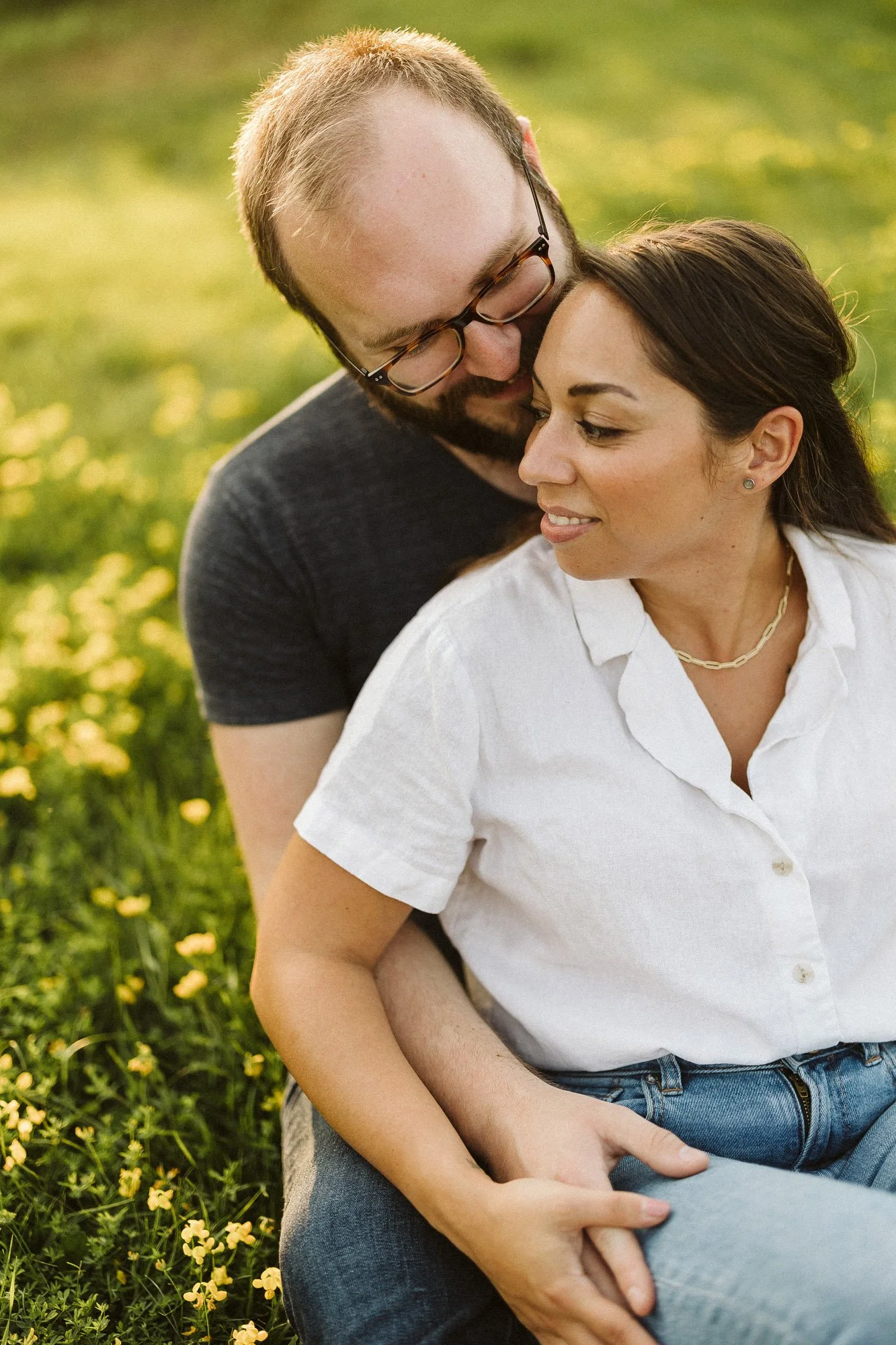 couple-sitting-in-green-field-embracing-couples-photographer-autumn-skye-phoenix-boston.jpg