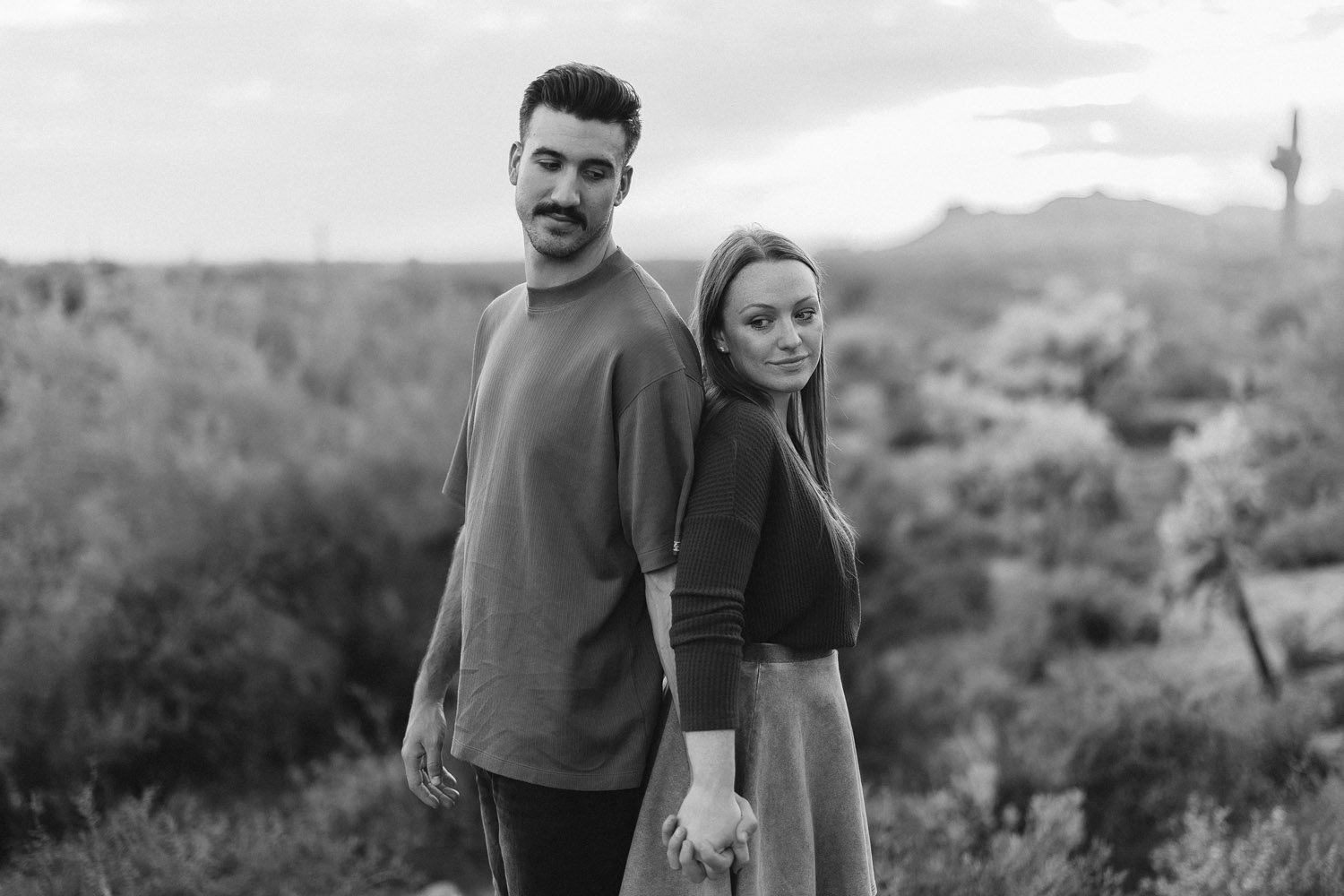 Couple-standing-back-toback-monochrome-phoenix-landscape-autumn-skye.jpg