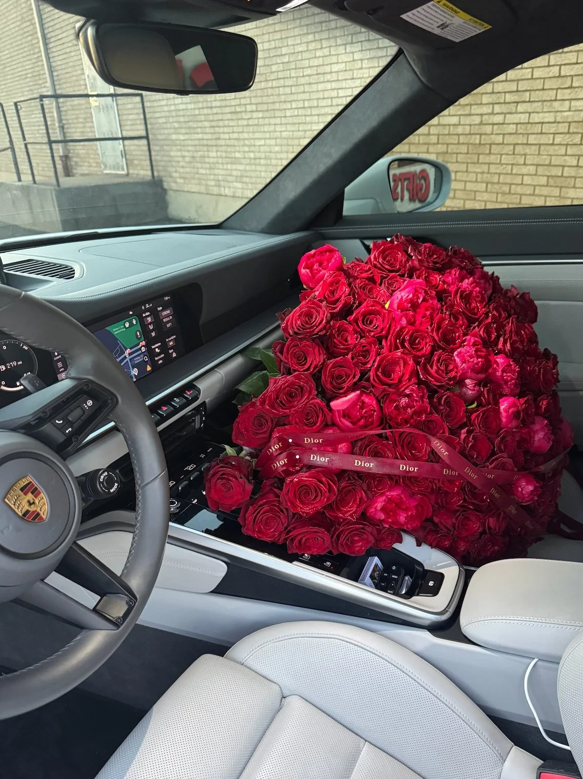 lovetoyourstep-red-rose-bouquet-car-passenger-seat.jpg