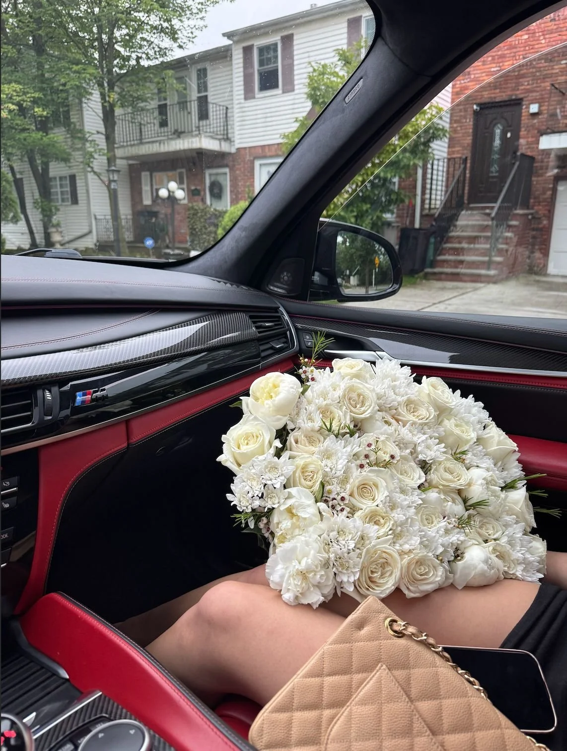 lovetoyourstep-white-rose-hydrangea-bouquet-car.jpg