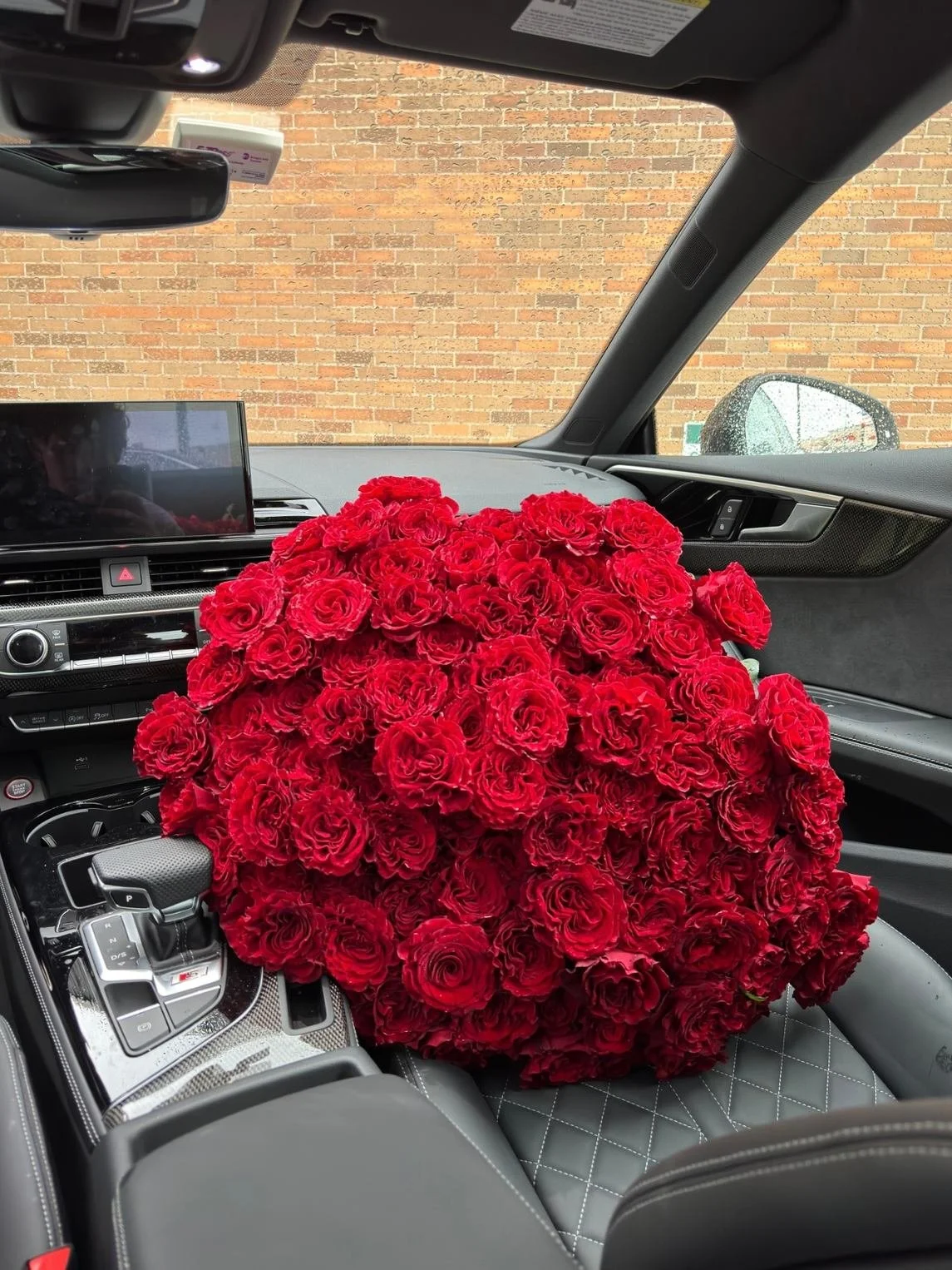 lovetoyourstep-large-red-rose-bouquet-gray-car-seat.jpg