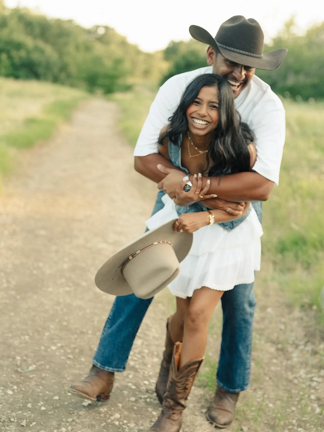 Ryan and Chamali alongside a sweet, Texas sunset in their Tecovas. 
Summer sessions always have me bracing for the heat, but they always end up so perfect! I loved catching up with these two and can&rsquo;t wait to celebrate them this year. 

#dallas