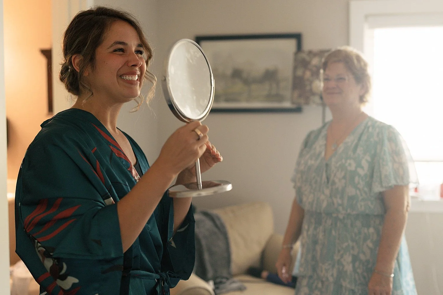  bride looks in the mirror while getting ready by Jessica Joseph photography 