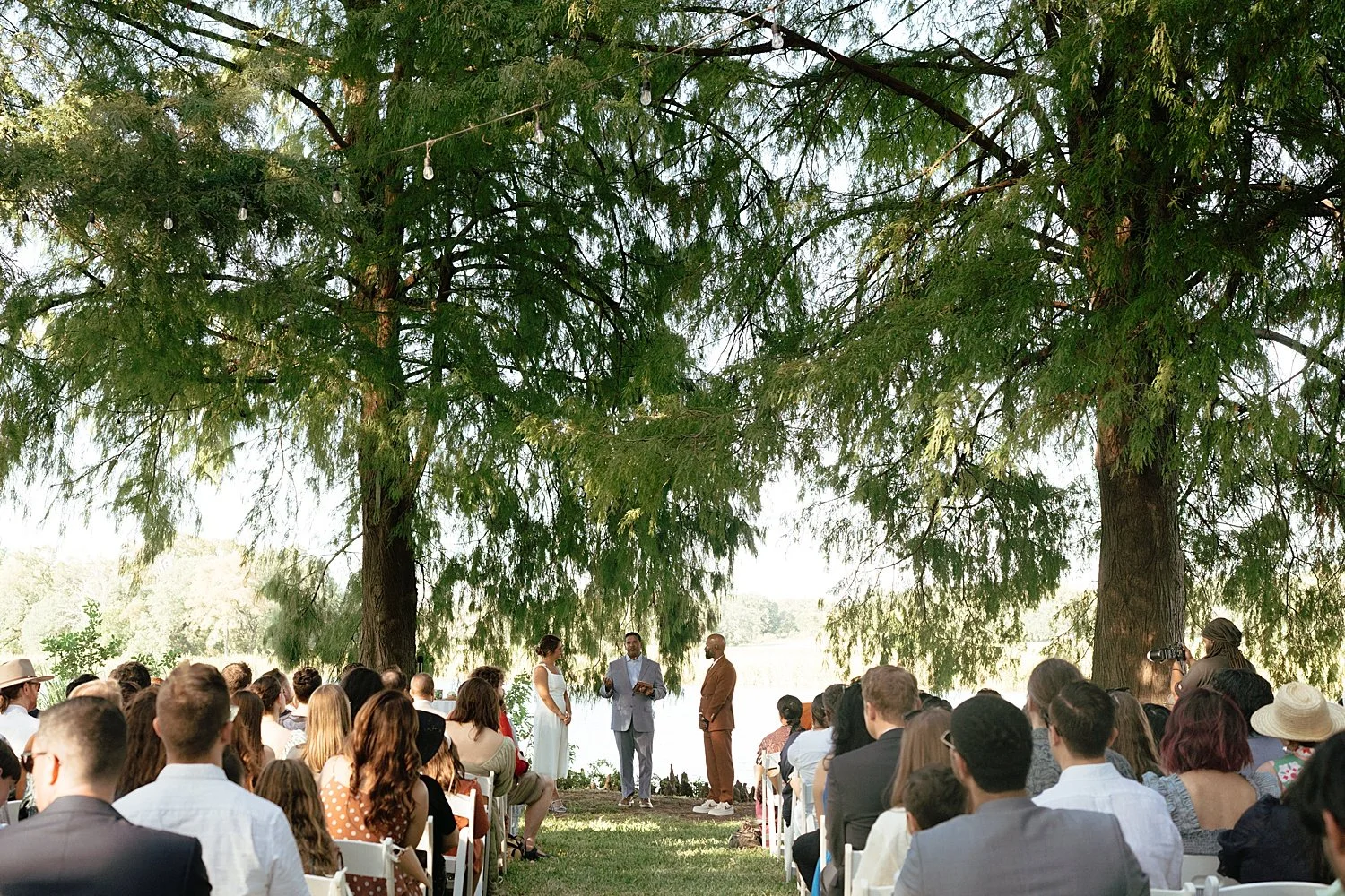  guests gather outside for ceremony in Waco, Texas by Austin wedding photographer 